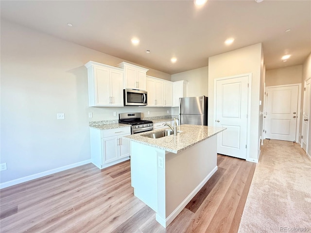 161 Robin Rd, Johnstown, CO 80534 - kitchen featuring baseboards, recessed lighting, white cabinets, stainless steel appliances, and a sink