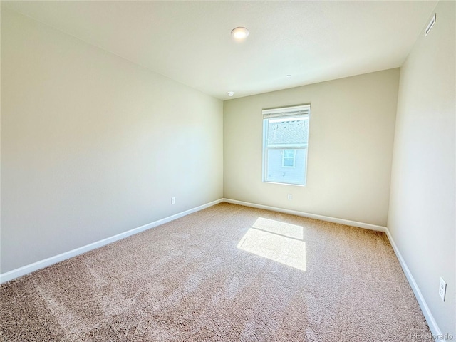 161 Robin Rd, Johnstown, CO 80534 - spare room featuring visible vents, baseboards, and carpet flooring
