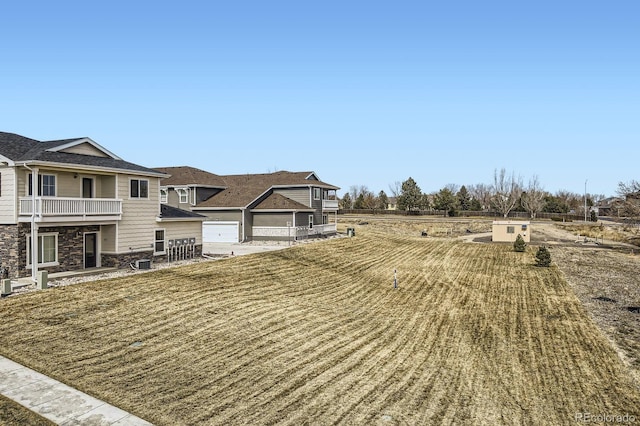 161 Robin Rd, Johnstown, CO 80534 - view of yard with a balcony