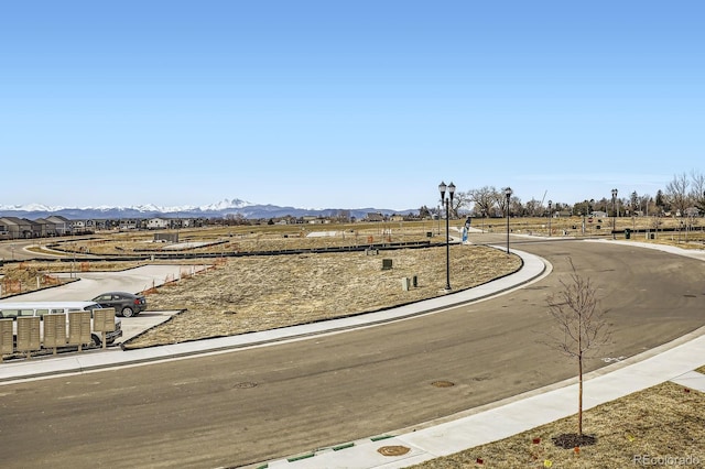 161 Robin Rd, Johnstown, CO 80534 - view of road featuring curbs, a mountain view, street lighting, and sidewalks
