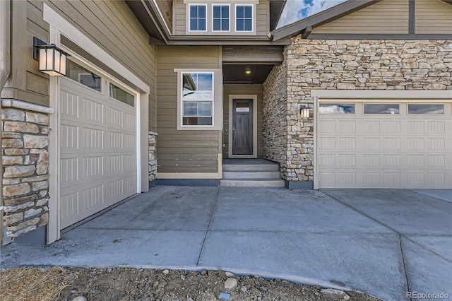 view of exterior entry featuring a garage