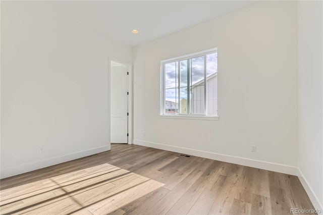 empty room with light wood-type flooring