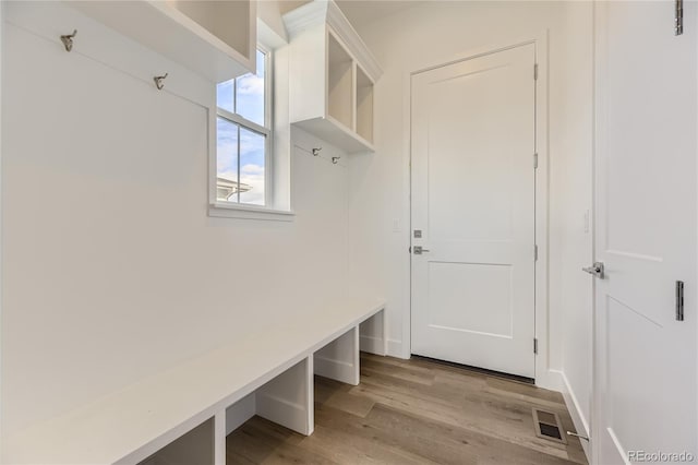 mudroom with light hardwood / wood-style flooring