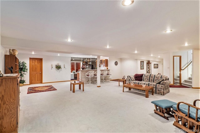 carpeted living room with indoor bar