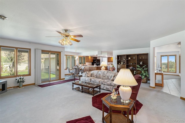 living room with light carpet and ceiling fan