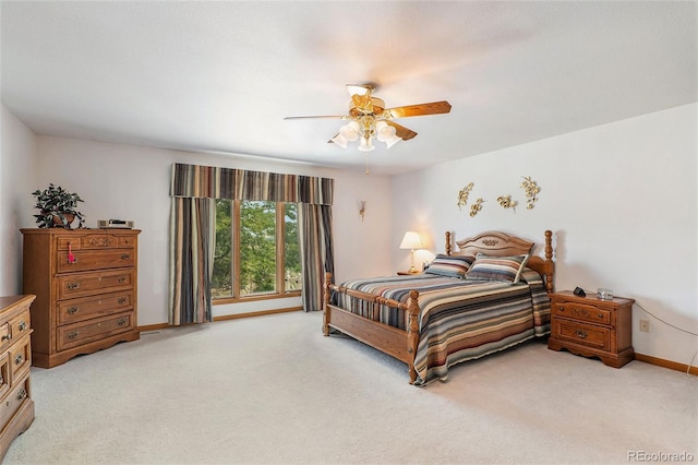 bedroom featuring ceiling fan and light colored carpet