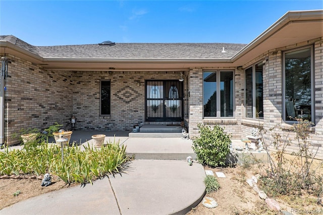 view of exterior entry featuring covered porch