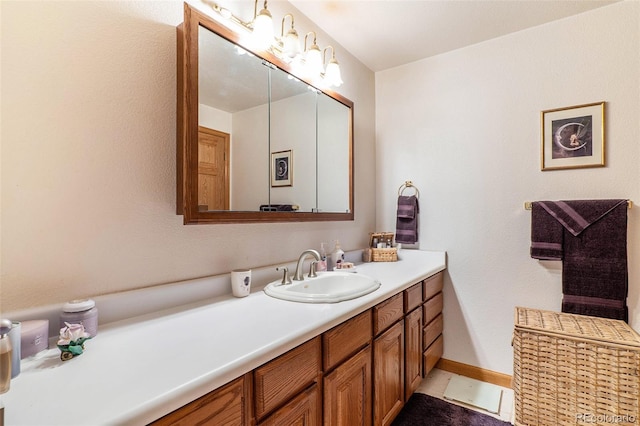 bathroom with tile patterned floors and vanity