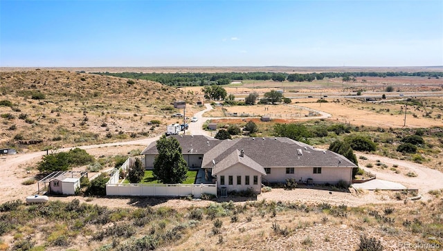 birds eye view of property featuring a rural view