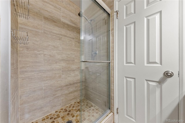 full bath featuring a shower stall