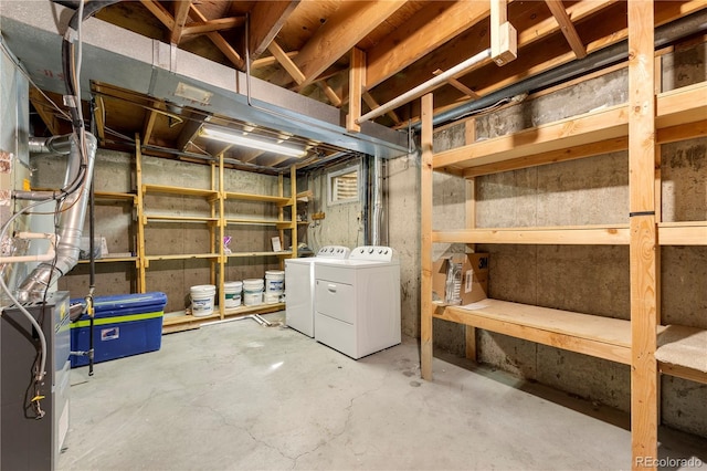 unfinished below grade area featuring washer and clothes dryer