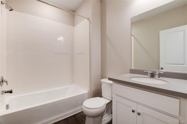 full bathroom featuring shower / bathtub combination, vanity, toilet, and hardwood / wood-style flooring