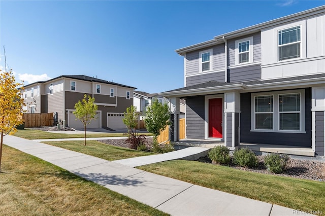 view of front of property with a front yard and a garage