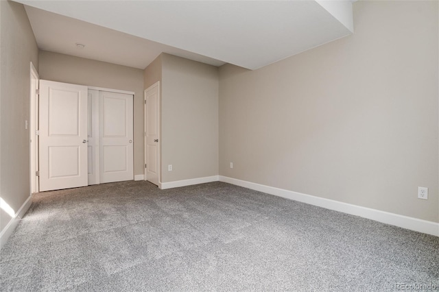 unfurnished bedroom with carpet