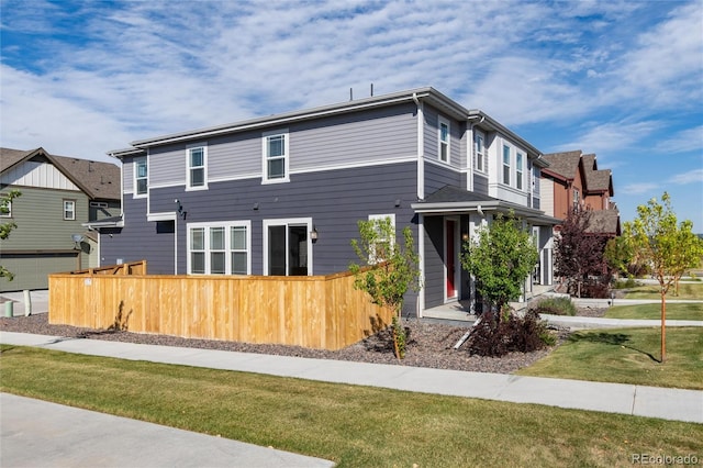 view of front of property with a front yard and a garage