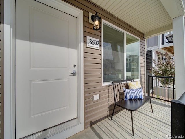 view of exterior entry featuring a porch