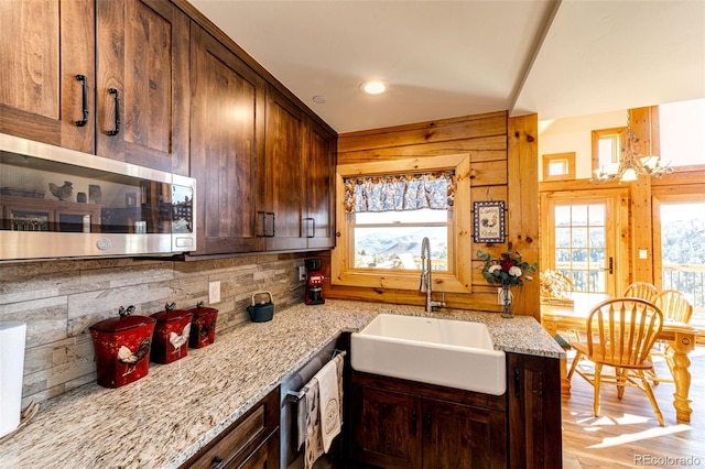 31266 Half Peak Trl, Pine, CO 80470 - kitchen featuring a sink, stainless steel microwave, light stone countertops, tasteful backsplash, and recessed lighting