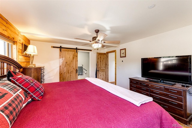 31266 Half Peak Trl, Pine, CO 80470 - bedroom featuring a barn door and a ceiling fan