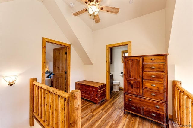 31266 Half Peak Trl, Pine, CO 80470 - bedroom with light wood finished floors, ensuite bath, and a ceiling fan