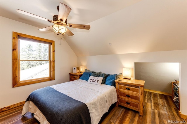 31266 Half Peak Trl, Pine, CO 80470 - bedroom with dark wood-style flooring, vaulted ceiling, a ceiling fan, and baseboards