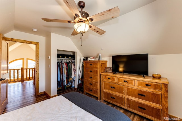 31266 Half Peak Trl, Pine, CO 80470 - bedroom with lofted ceiling, dark wood-type flooring, a closet, a ceiling fan, and baseboards
