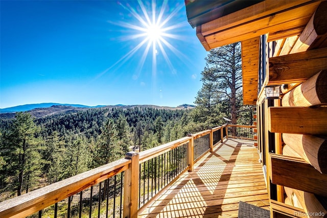 31266 Half Peak Trl, Pine, CO 80470 - wooden terrace with a view of trees and a mountain view