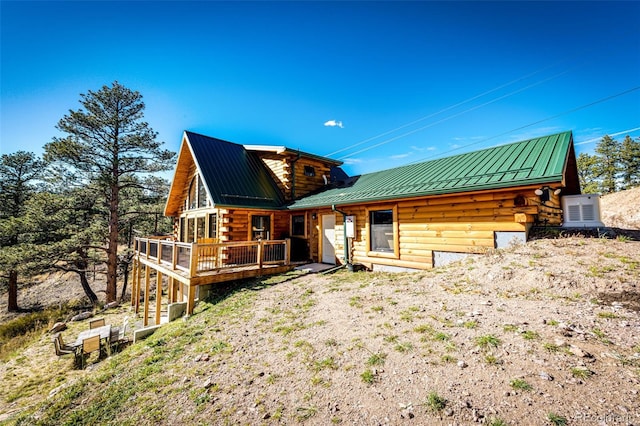 31266 Half Peak Trl, Pine, CO 80470 - back of property featuring log exterior, a wooden deck, metal roof, and a standing seam roof