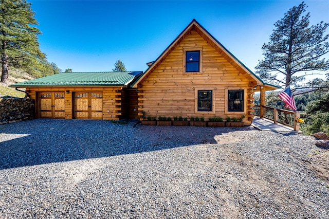 31266 Half Peak Trl, Pine, CO 80470 - view of front of home with log siding and metal roof