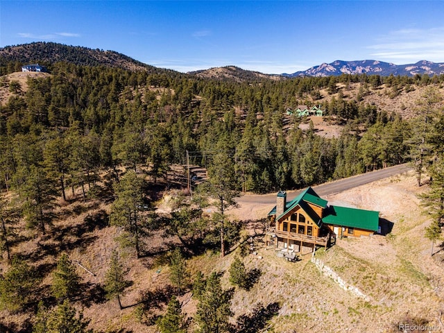 31266 Half Peak Trl, Pine, CO 80470 - view of subject property featuring a mountainous background and a heavily wooded area
