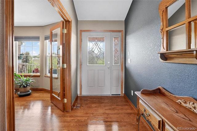 34827 E 7th Ave, Watkins, CO 80137 - entryway with wood finished floors and a textured wall