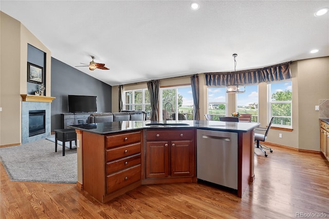 34827 E 7th Ave, Watkins, CO 80137 - kitchen with stainless steel dishwasher, plenty of natural light, wood finished floors, vaulted ceiling, and recessed lighting