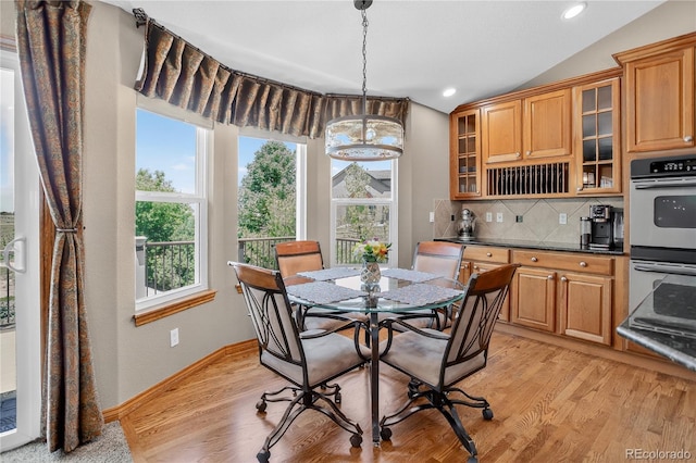 34827 E 7th Ave, Watkins, CO 80137 - dining space featuring healthy amount of natural light, vaulted ceiling, recessed lighting, and light wood-style flooring