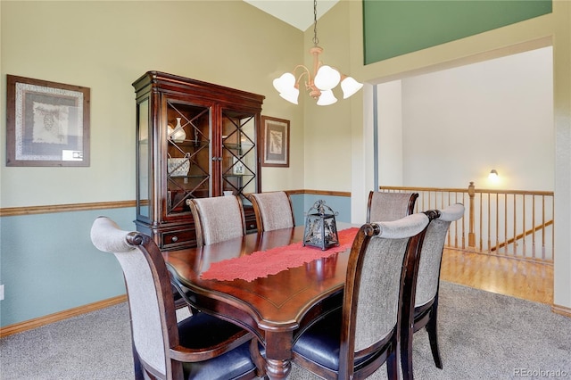 34827 E 7th Ave, Watkins, CO 80137 - carpeted dining space featuring a chandelier and high vaulted ceiling