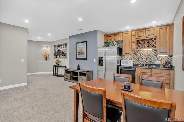 34827 E 7th Ave, Watkins, CO 80137 - dining space with light colored carpet, bar, and recessed lighting