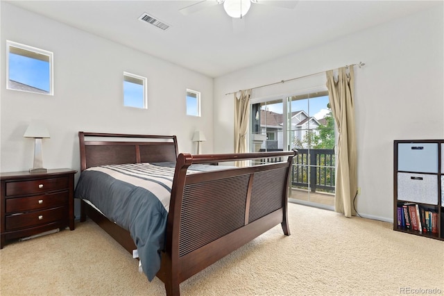 carpeted bedroom featuring access to exterior, baseboards, visible vents, and ceiling fan