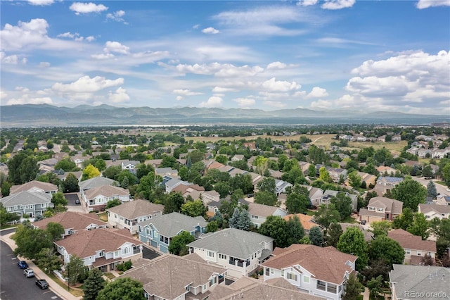 drone / aerial view featuring a residential view and a mountain view