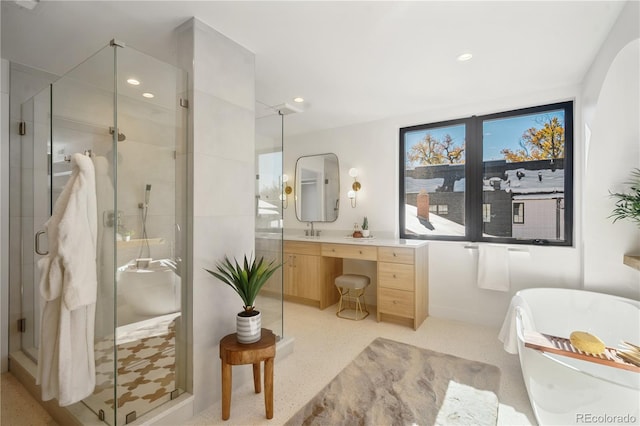 bathroom featuring vanity and a shower with shower door