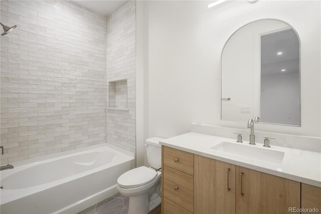 full bathroom with tile patterned floors, tiled shower / bath combo, toilet, and vanity