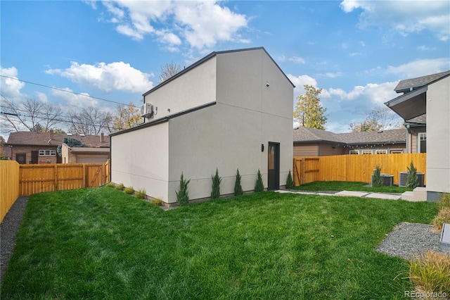 back of house featuring a yard