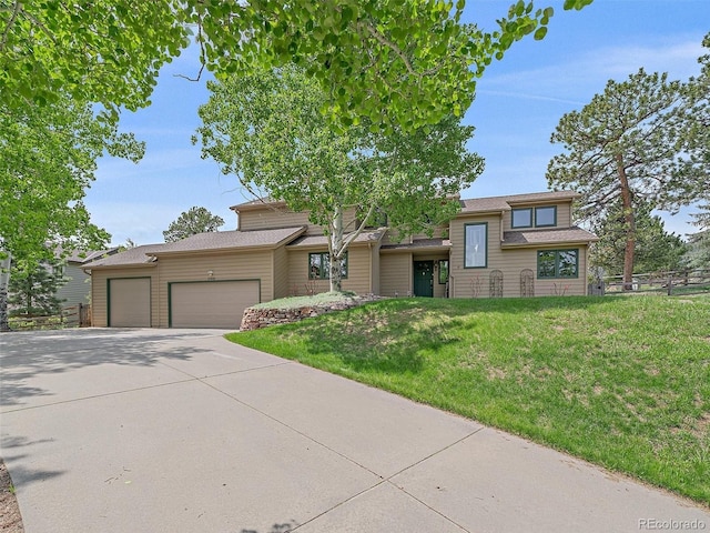 31412 N Bermuda Dunes Dr, Evergreen, CO 80439 - view of front of house featuring an attached garage and concrete driveway