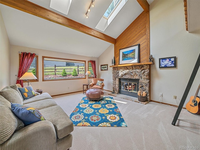 31412 N Bermuda Dunes Dr, Evergreen, CO 80439 - carpeted living area featuring a skylight, baseboards, beam ceiling, a fireplace, and high vaulted ceiling
