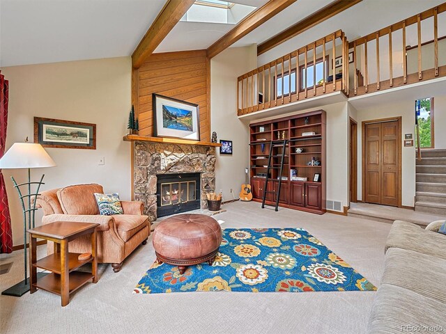 31412 N Bermuda Dunes Dr, Evergreen, CO 80439 - living room with carpet, a fireplace, stairway, a towering ceiling, and beam ceiling
