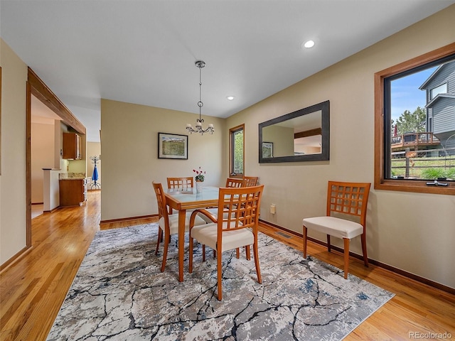 31412 N Bermuda Dunes Dr, Evergreen, CO 80439 - dining space with healthy amount of natural light, a chandelier, light wood-style flooring, and recessed lighting