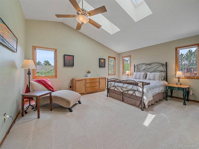 31412 N Bermuda Dunes Dr, Evergreen, CO 80439 - bedroom with a skylight, multiple windows, light colored carpet, lofted ceiling, and baseboards