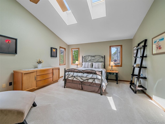 31412 N Bermuda Dunes Dr, Evergreen, CO 80439 - bedroom with light carpet, multiple windows, a skylight, baseboards, and high vaulted ceiling
