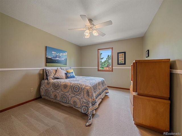 31412 N Bermuda Dunes Dr, Evergreen, CO 80439 - bedroom with baseboards, light colored carpet, and ceiling fan