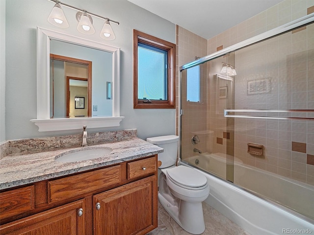 31412 N Bermuda Dunes Dr, Evergreen, CO 80439 - bathroom with toilet, vanity, and bath / shower combo with glass door