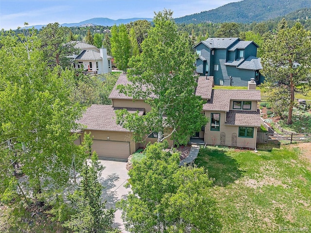 31412 N Bermuda Dunes Dr, Evergreen, CO 80439 - view from above of property featuring a mountainous background and a heavily wooded area