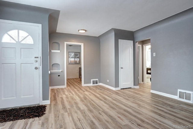361 N Raleigh St, Denver, CO 80219 - entrance foyer with light wood finished floors and baseboards