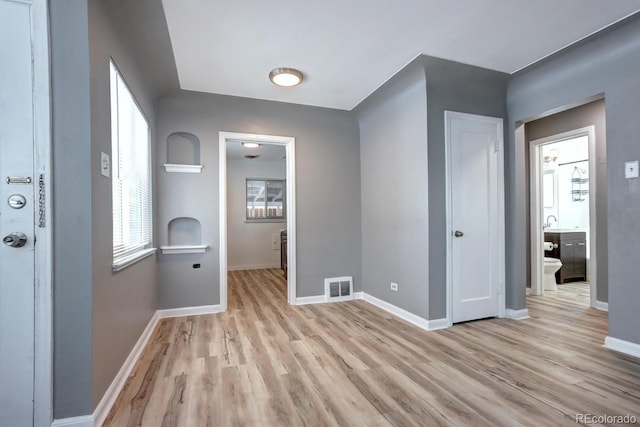 361 N Raleigh St, Denver, CO 80219 - hall featuring light wood-style flooring and baseboards